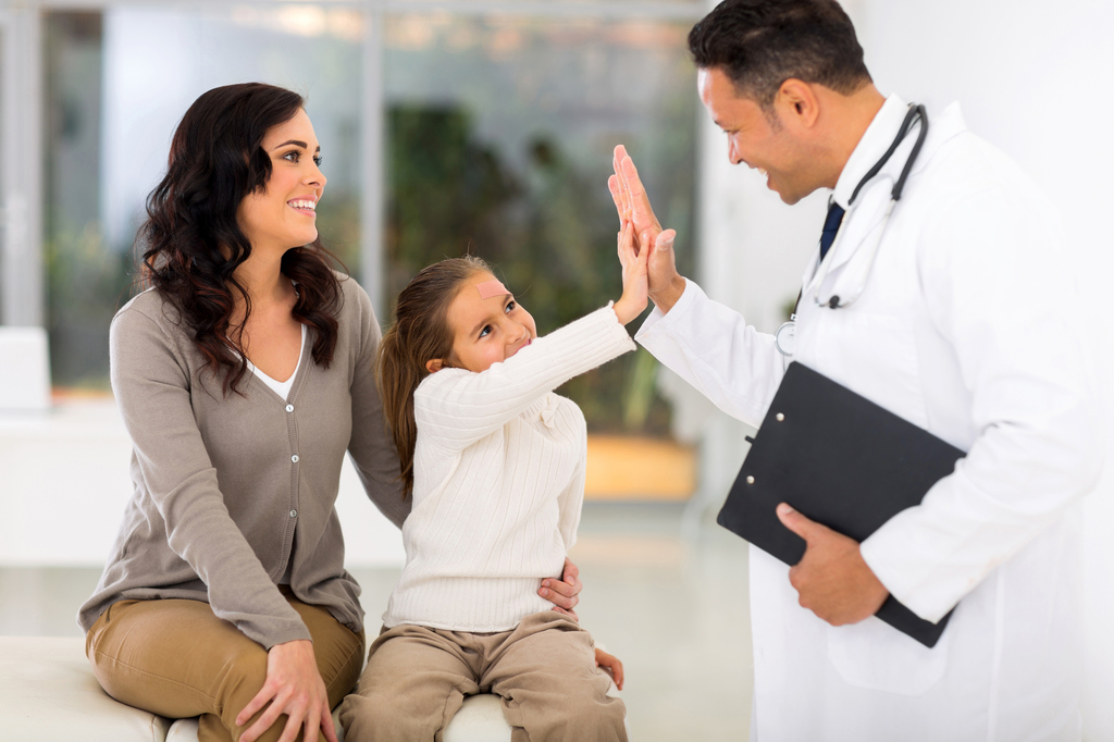 doctor high fiving a kid
