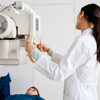 doctor doing an image lab test on a patient