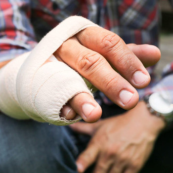 man with his hand and two fingers wrapped for protection