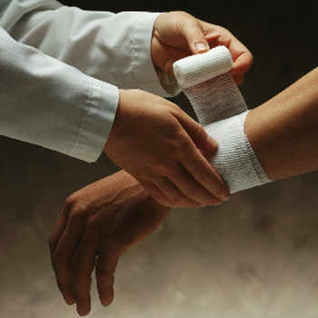 doctor wrapping someone's wrist to help it